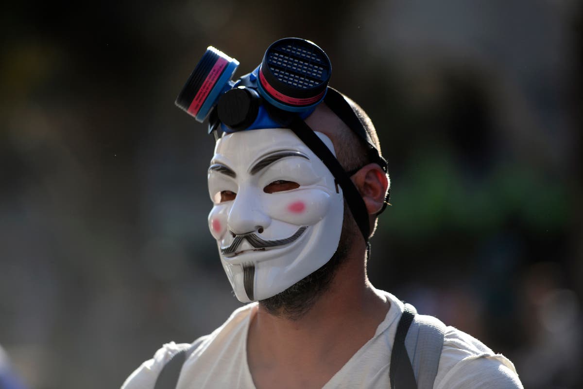 Anonymous news – live: Hacking attacks launched across Europe as internet activist group trolls Putin