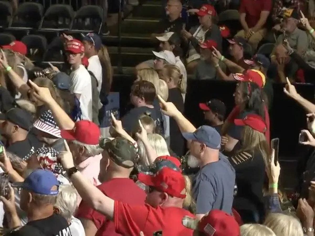Is Trump fans’ ‘weird’ one-finger salute at rally a QAnon tribute?
