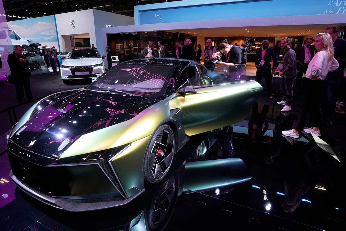 Electric vehicles take center stage at pared-back Paris show