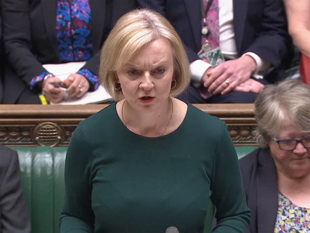 Liz Truss ‘lost in denial’, says Keir Starmer – as PM claims no spending cuts ahead