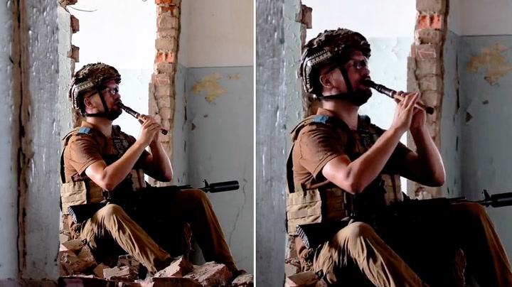 Ukrainian soldier plays music from ruins of destroyed building | News