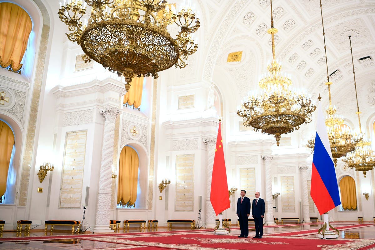 Putin hosts Xi in the Kremlin with imperial palace pageantry