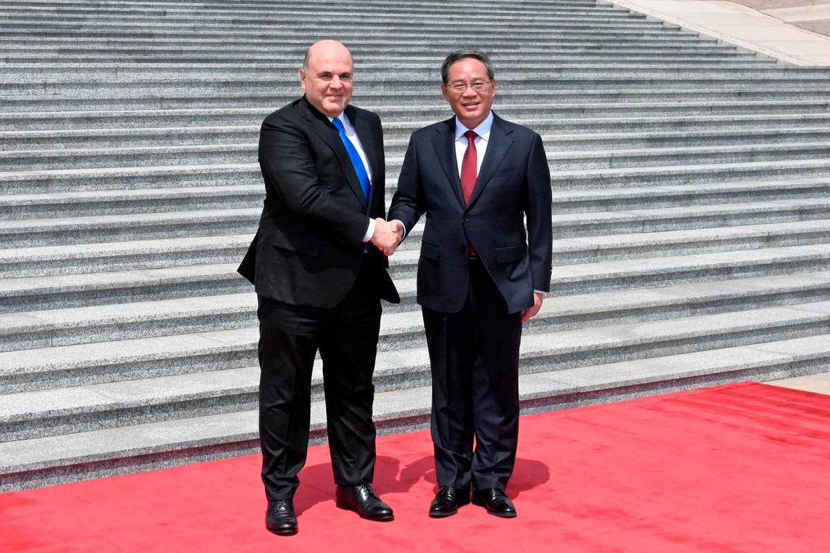 On Beijing visit, Russian prime minister says pressure from West is strengthening ties with China