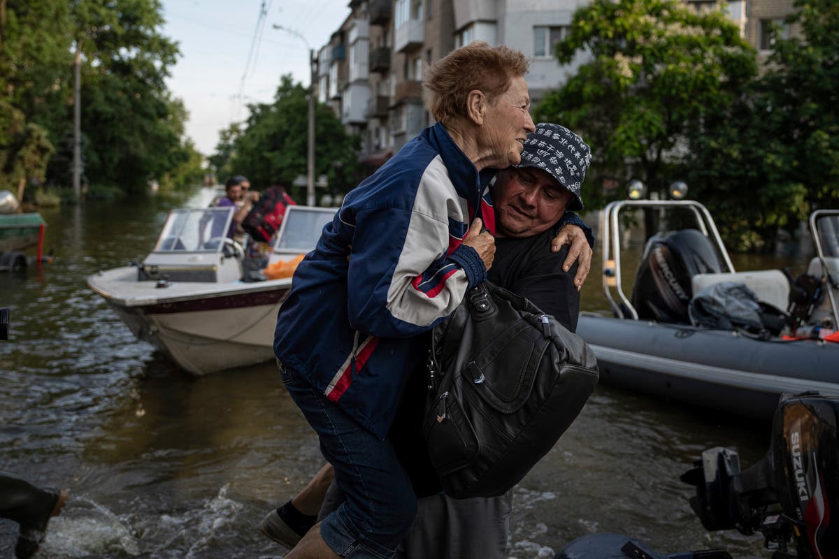 Rescuers are braving snipers and racing time to ferry Ukrainians out of Russian-occupied flood zones