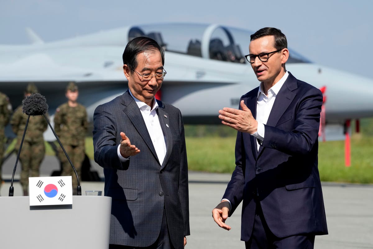 South Korean and Polish leaders visit an air base in eastern Poland, discuss defense and energy ties